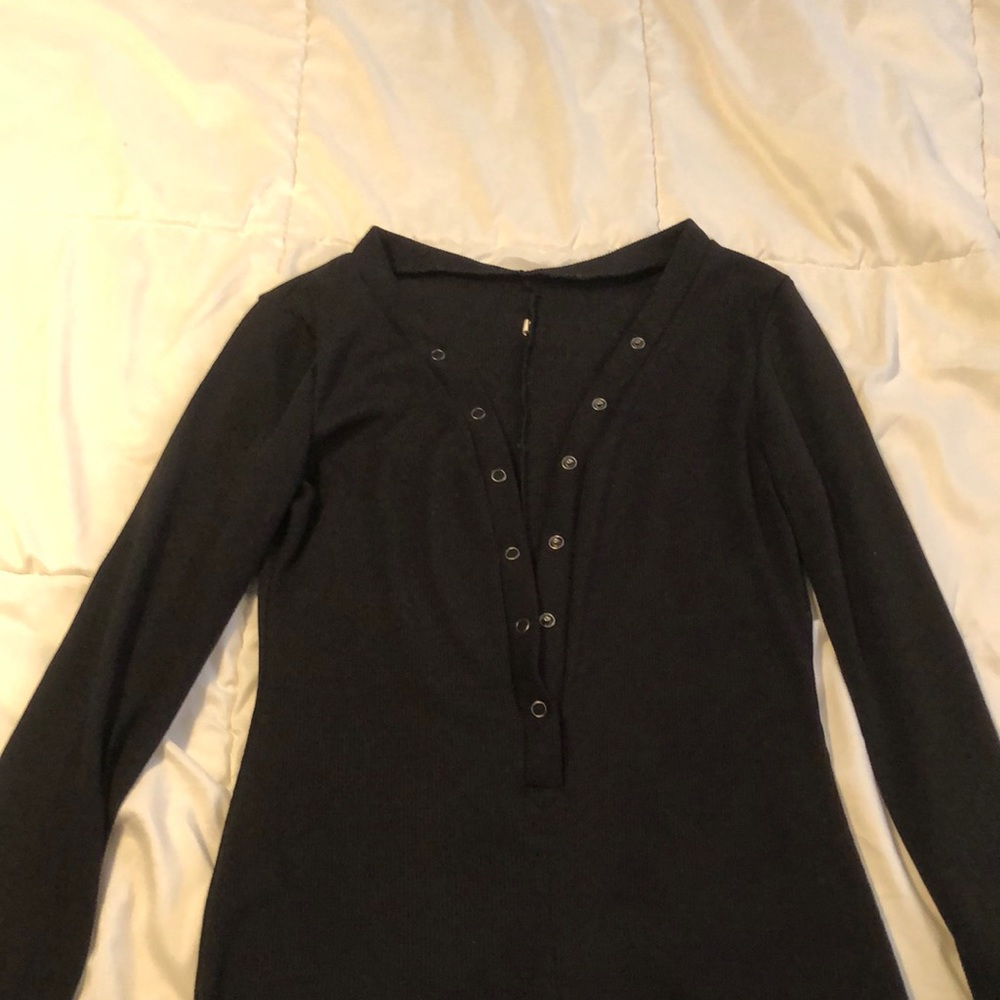 Black long sleeve romper.